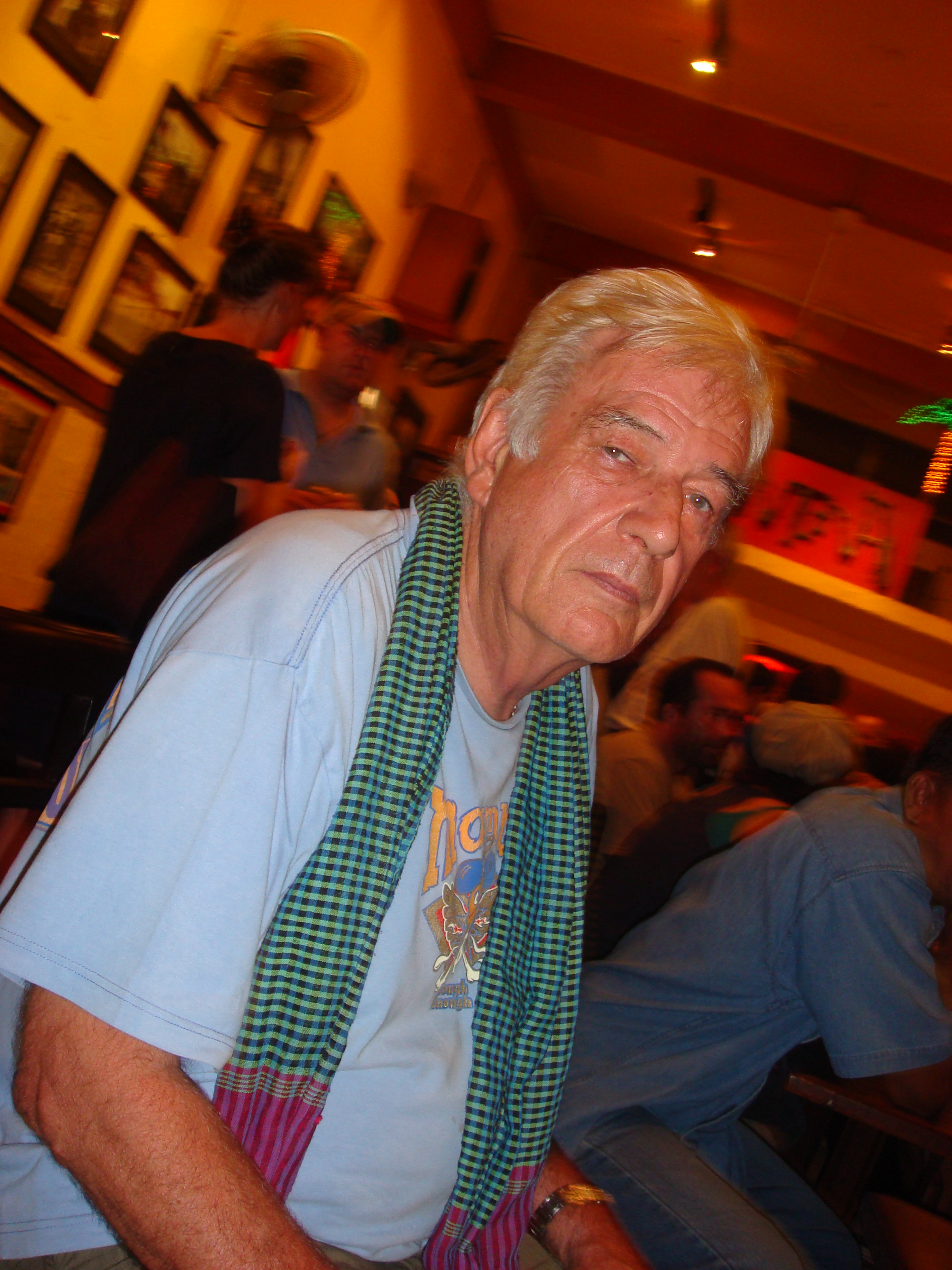 War photographer Tim Page in iconic krama (Cantina, 1 July 2010)