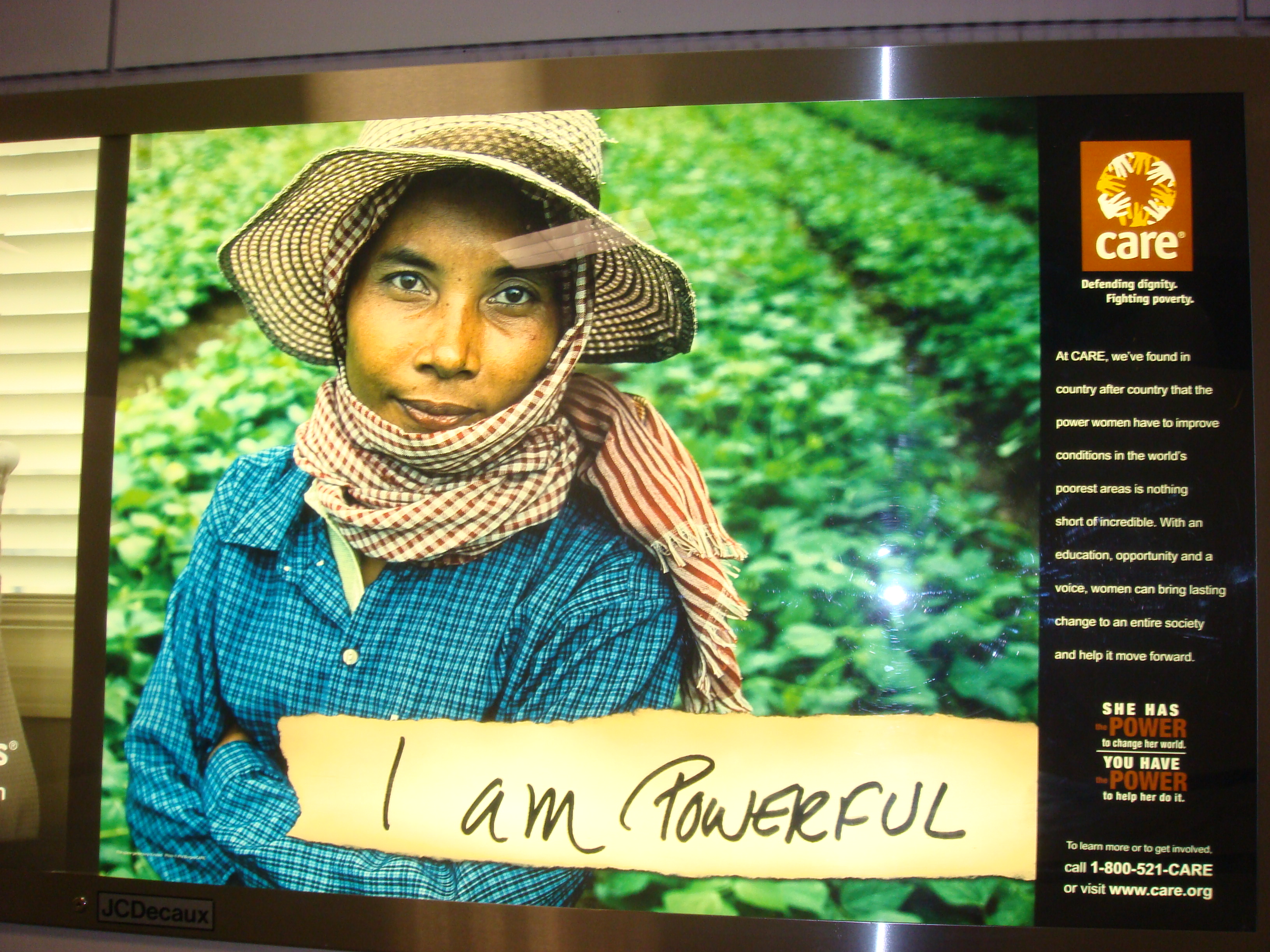 CARE billboard of Khmer woman "I am powerful", Newark Intl Airport, May 2010