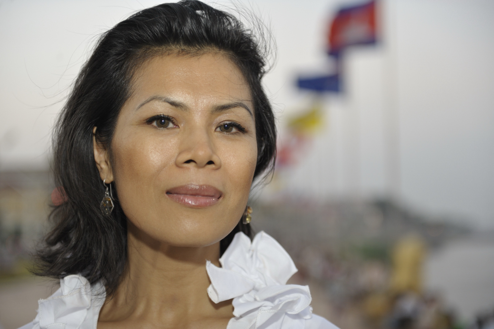 Theary Seng in front of palace (photo by Roland Neveu, Dec. 2009) Theary Seng along the river in front of Royal Palace (photo by Roland Neveu, Dec. 2009)